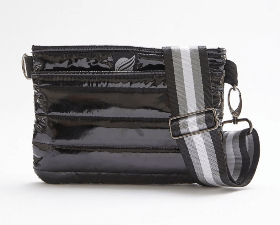 Black puffy crossbody bag with striped strap