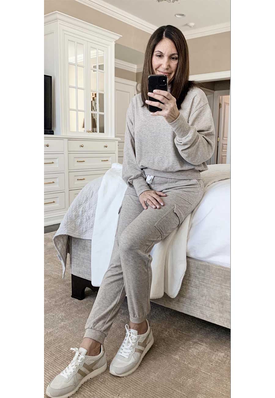 Alysia wearing nude matching sweatshirt and joggers with sneakers